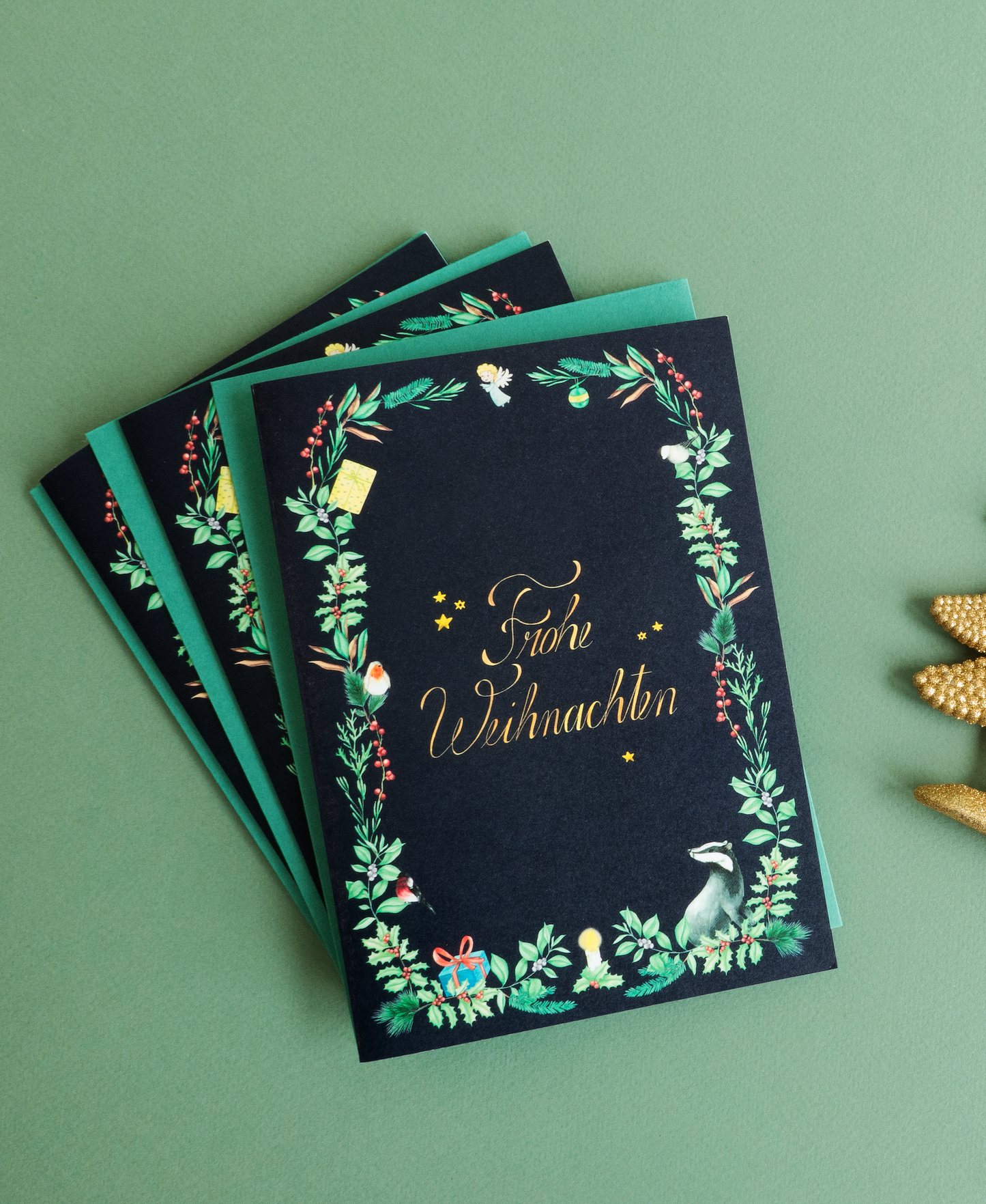 Christmas stationery inspired by forest animals, plants and an angel, painted in watercolour and printed on high-quality paper by Huber und Lerner. Showing a greeting card in blue 01