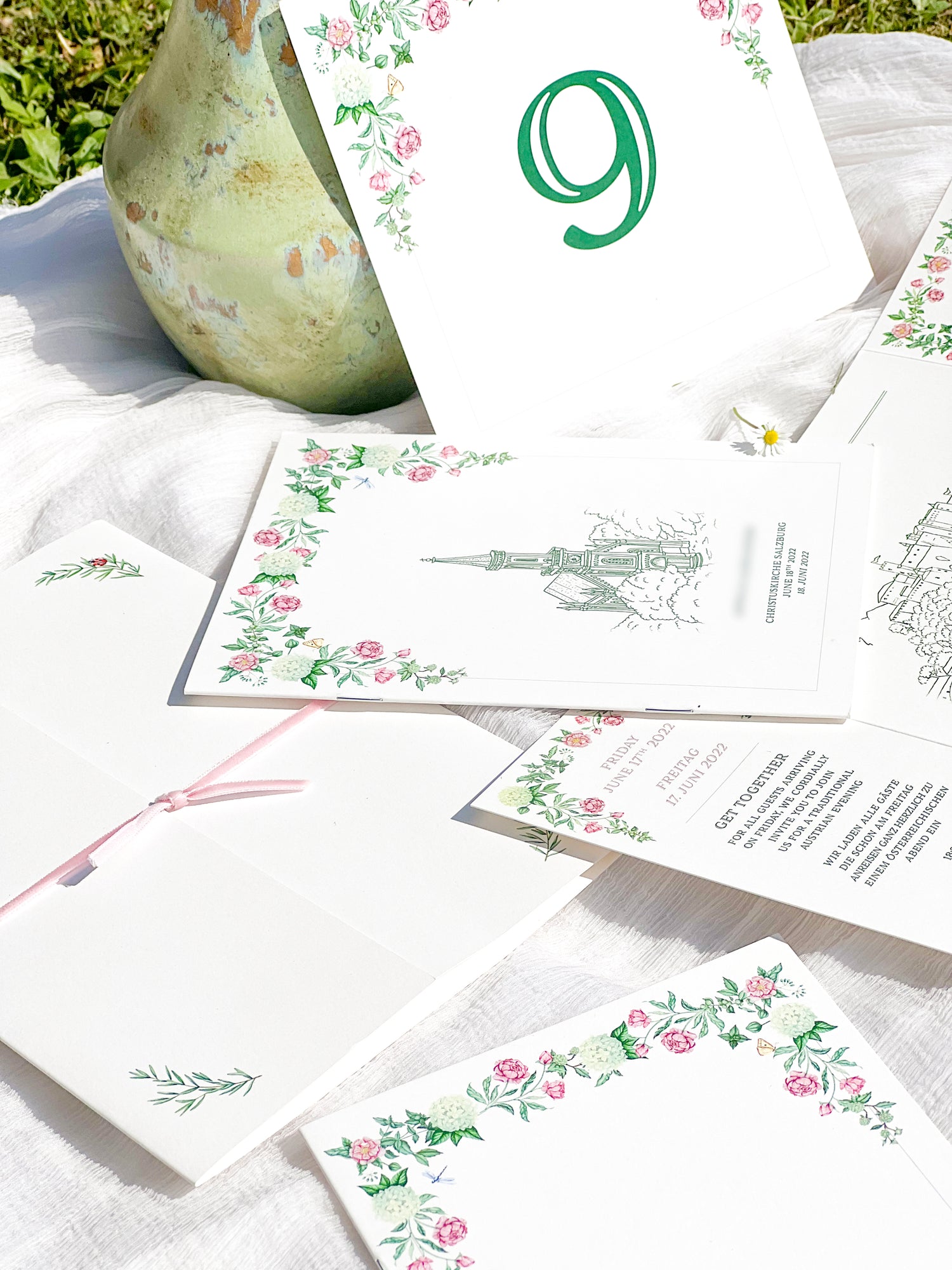 Personalised wedding invitations and stationery featuring delicate watercolour roses and spring flowers, for a dream wedding in Salzburg, Austria