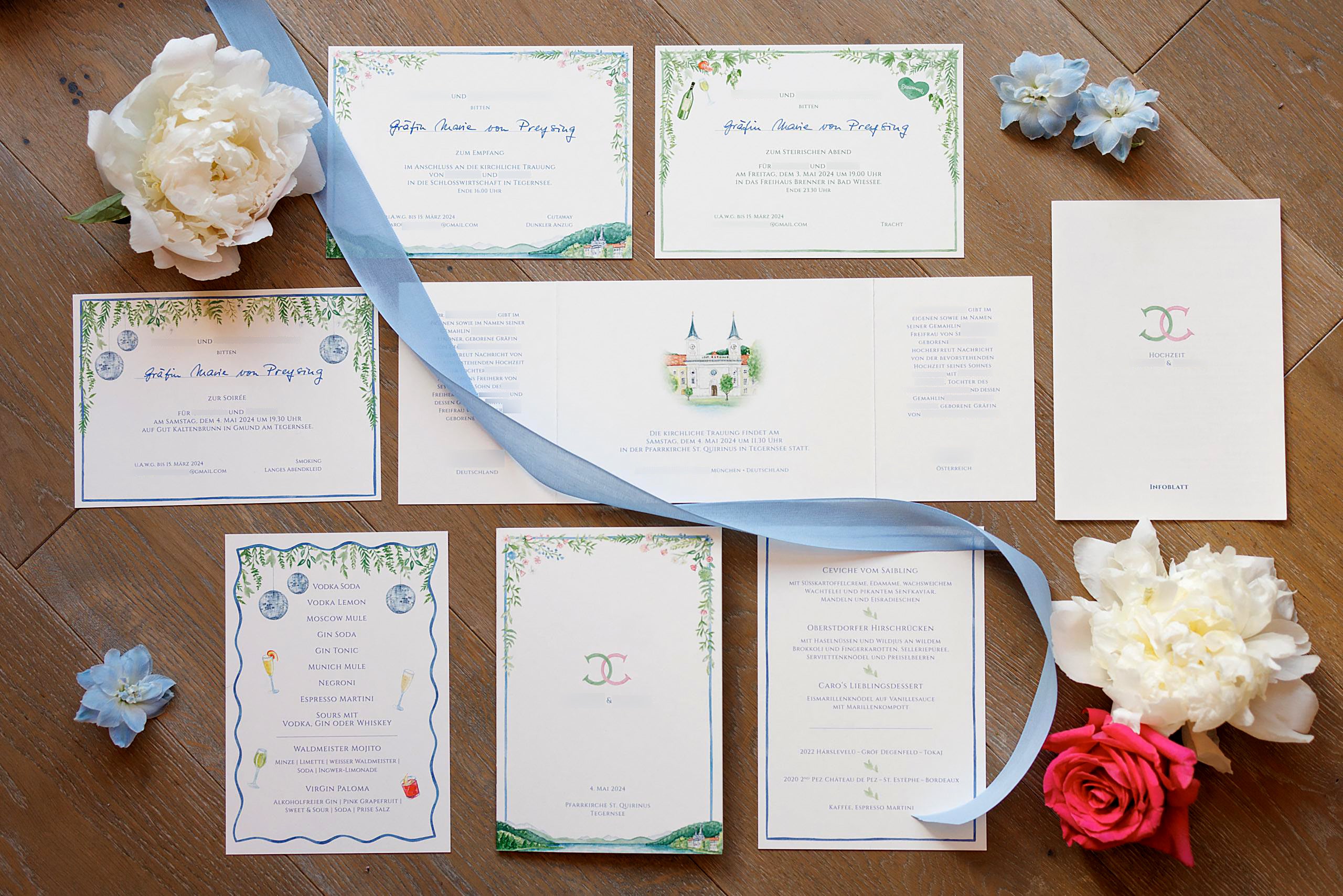 Personalised wedding invitations and stationery, like menu and bar card, featuring delicate watercolour flowers in lightblue, pink and cream, a romantic church for the stationery, and a personalised Monogram for the couple
