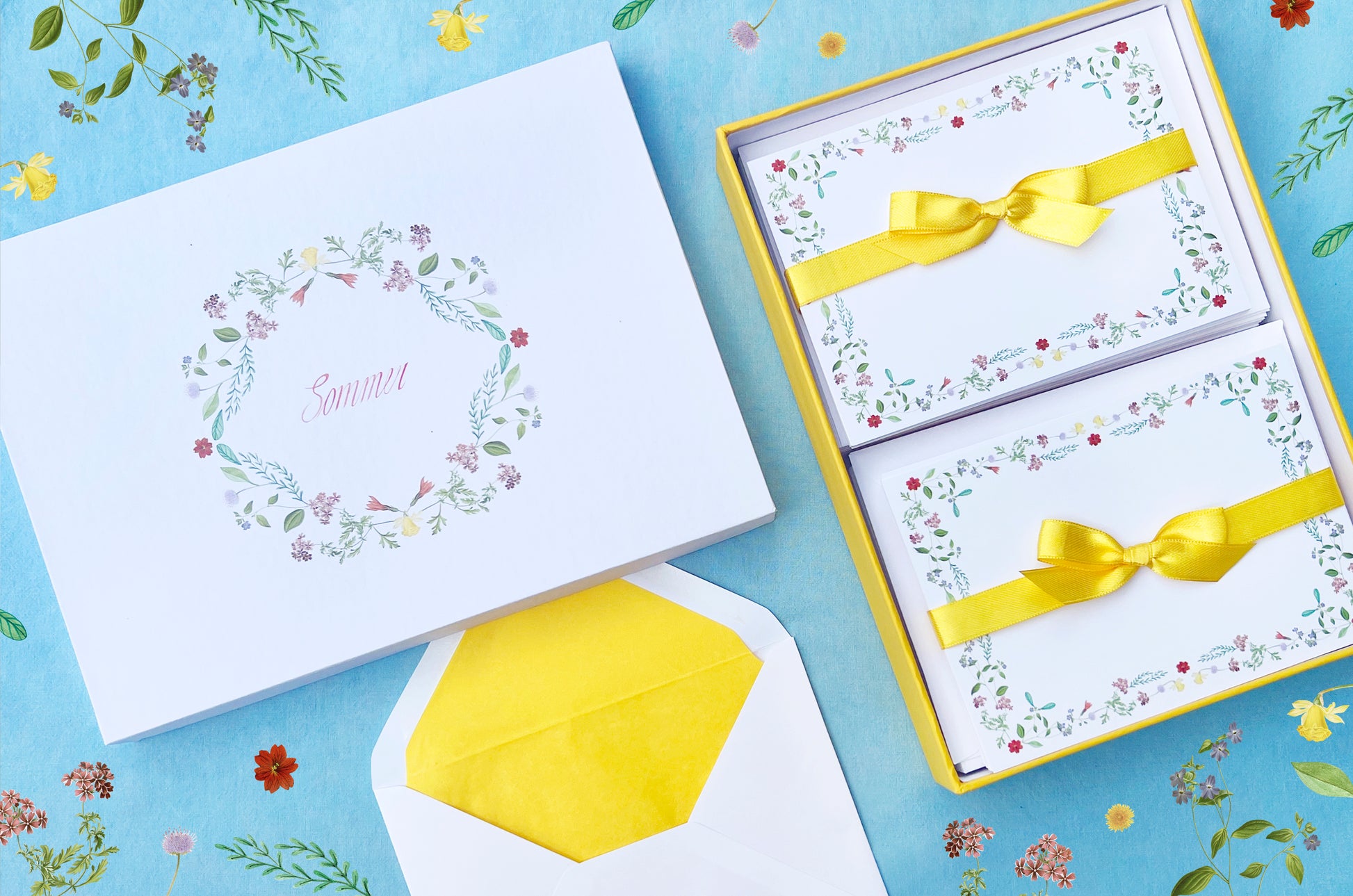 Summer-themed letter paper box from the 'Four Seasons' set, featuring 50 cards and 50 colourfully lined envelopes adorned with illustrations of flowers and plants in a charming pattern NEW