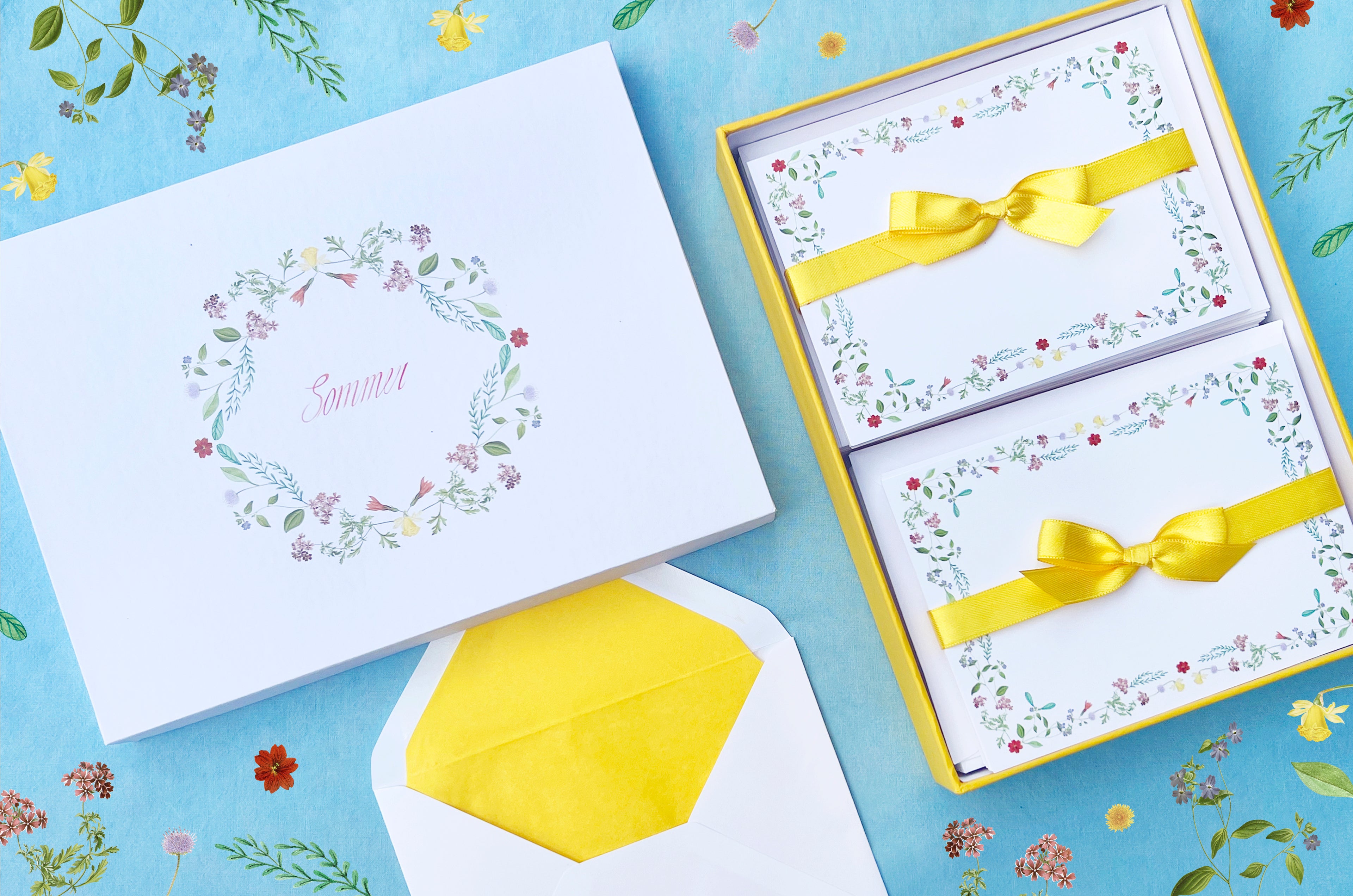 Summer-themed letter paper box from the 'Four Seasons' set, featuring 50 cards and 50 colourfully lined envelopes adorned with illustrations of flowers and plants in a charming pattern NEW