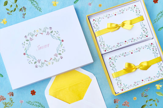 Summer-themed letter paper box from the 'Four Seasons' set, featuring 50 cards and 50 colourfully lined envelopes adorned with illustrations of flowers and plants in a charming pattern NEW