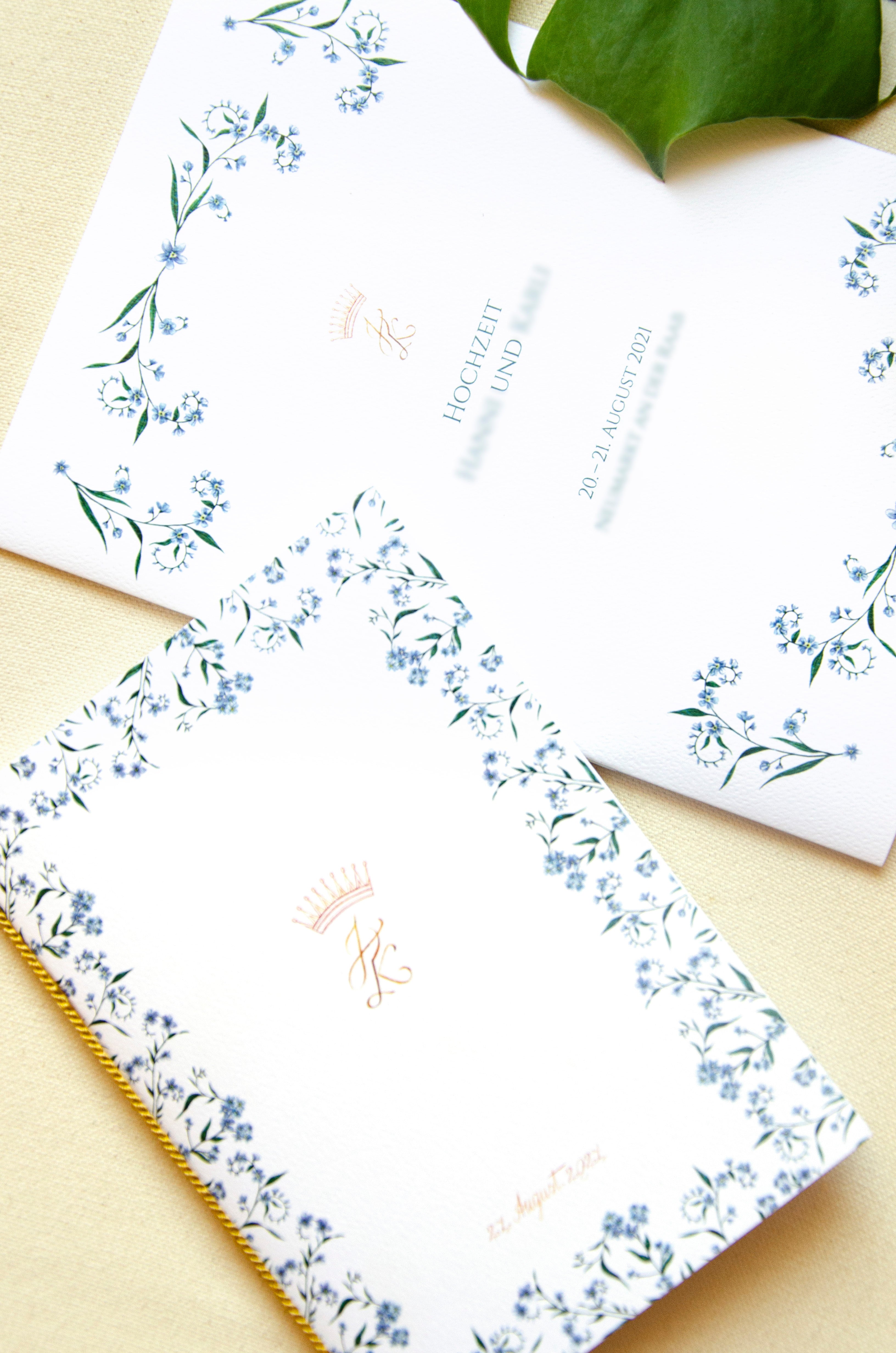 Personalised wedding invitations and stationery featuring delicate watercolour flowers church booklet and information plan