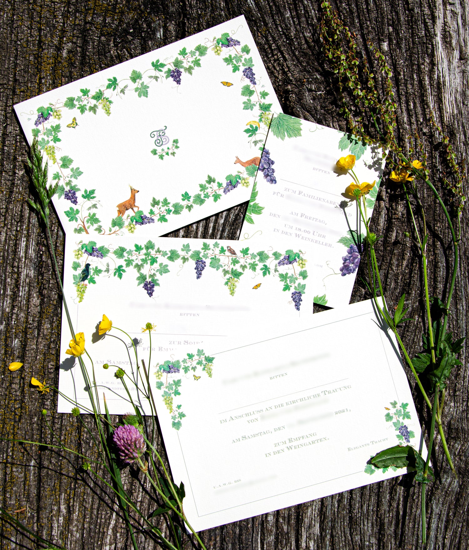 Personalised wedding invitations and stationery featuring delicate watercolour flowers, winery, deers, butterflies and a stylised monogram