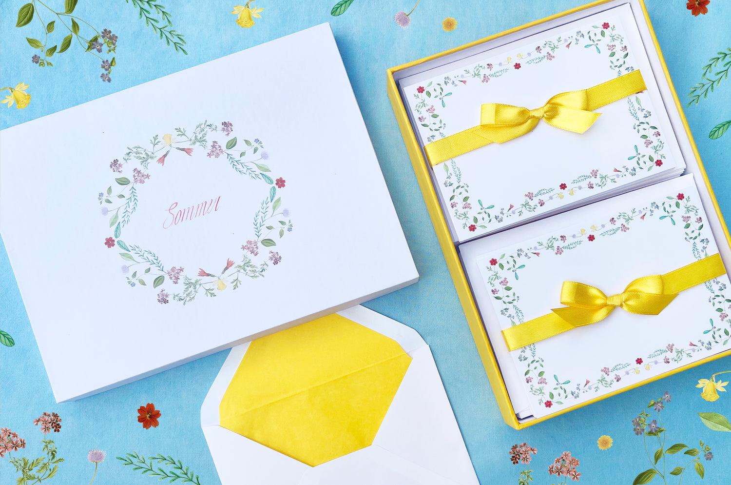 Summer-themed letter paper box from the 'Four Seasons' set, featuring 50 cards and 50 colourfully lined envelopes adorned with illustrations of flowers and plants in a charming pattern NEW